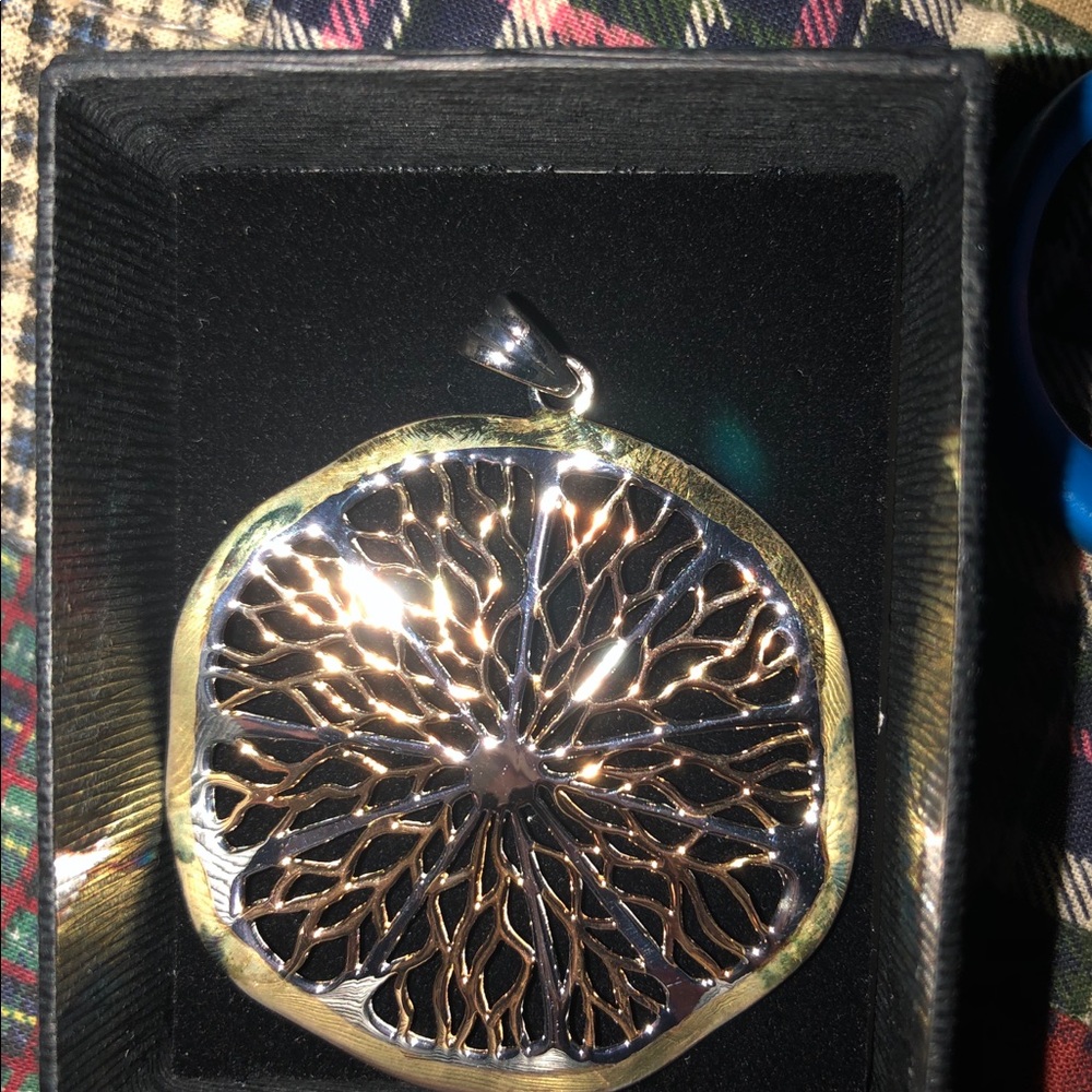 Gold and silver pendant
